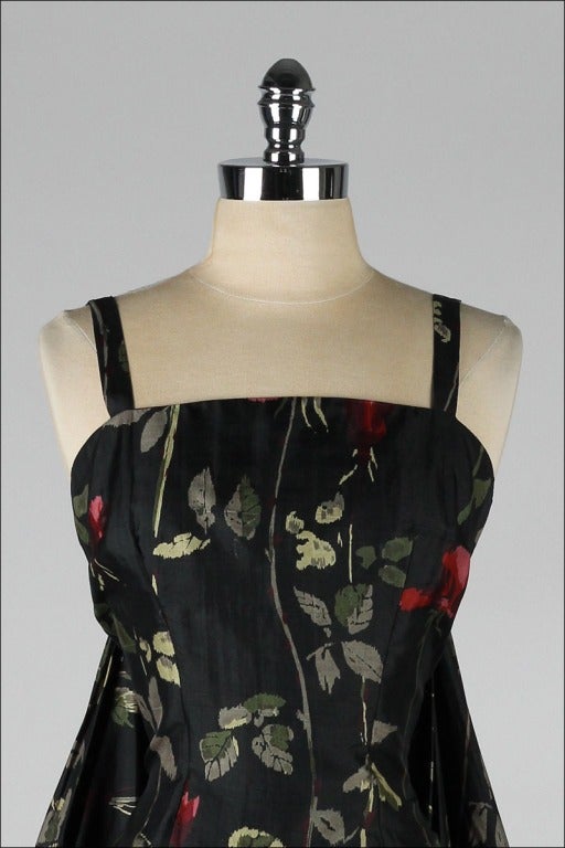 vintage 1950's dress

* black floral silk
* acetate lining
* beautiful back drape
* metal back zipper
* by Suzy Perette

condition | excellent

fits like medium

length 47