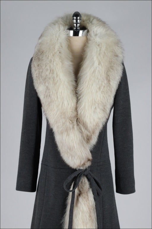 vintage 1960's coat

* heather gray lightweight knit wool
* silver fox fur trim
* acetate lining
* tie at waist
* Kiminetta by Gargiulo

condition | excellent - fur is shedding a bit due to age

fits like s/m

length 43