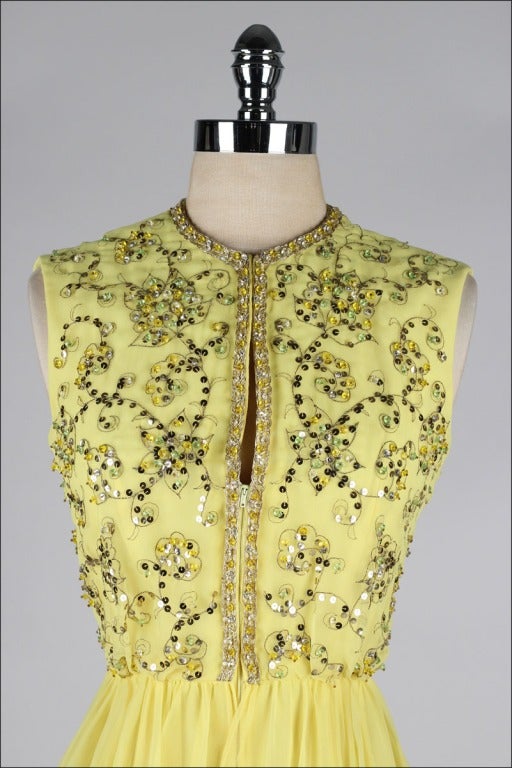 vintage 1960's dress

* citrus yellow silk crepe
* silk lining
* beautiful sequins and beading
* front zipper
* by Gino Charles

condition | excellent

fits like medium

length 40