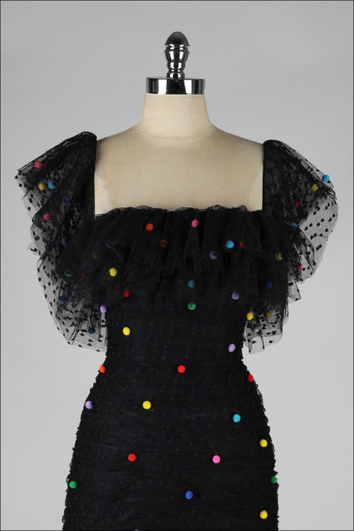 vintage 1980's dress

* black embroidered tulle
* tiny fuzzy colorful pom poms
* nylon lining
* boned bodice
* back zipper
* by Victor Costa

condition | excellent

fits like xs/s

length 38