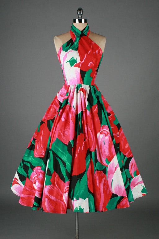 vintage 1980's dress

* red, pink, green tulip print cotton
* acetate and tulle linings
* twisted halter neck
* back zipper
* by Victor Costa

condition | excellent

fits like xs/s

length 50