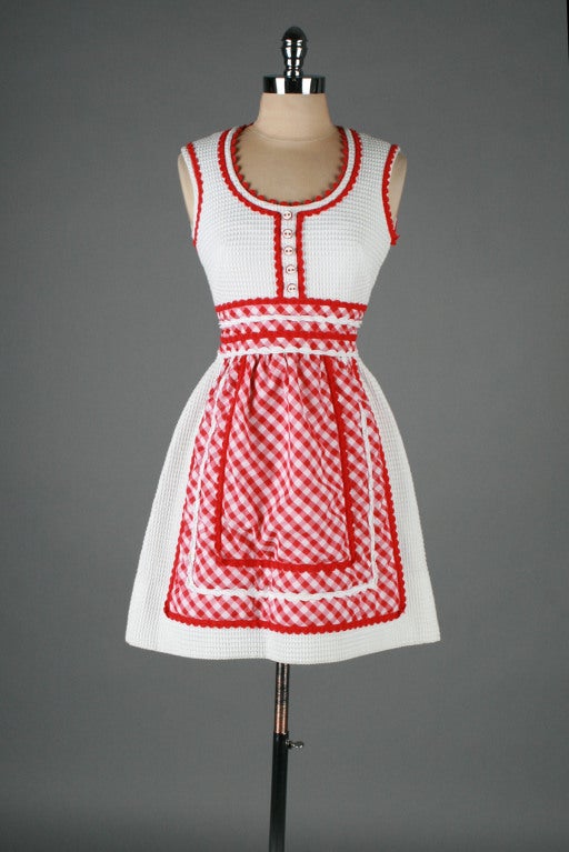 vintage 1960's dress

* white waffle texture cotton
* woven cotton lining
* gingham print skirt
* candy buttons
* ric rac trim
* back zipper
* by Howard Wolf

condition | excellent

fits like xs

length 34
