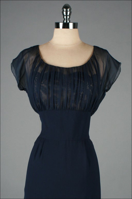 vintage 1950's dress

* deep blue rayon
* chiffon and lace illusion bodice
* silk lining
* metal back zipper
* by Terry Allen

condition | excellent

fits like large

length 47