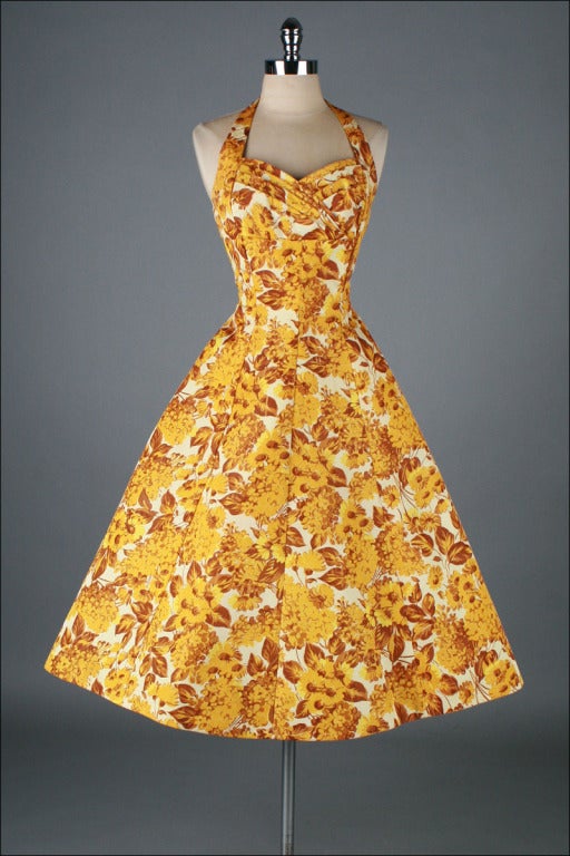 vintage 1950's dress

* goldenrod floral taffeta
* pellon backed
* back bow with sashes
* full skirt
* metal back zipper
* by Emma Domb

condition | excellent

fits like small

length 48