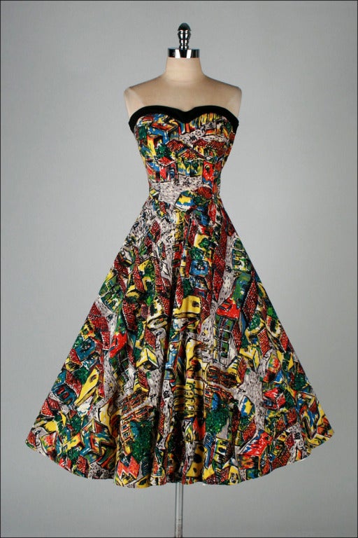 vintage 1950's dress

* amazing 100% handmade dress
* colorful ethnic print cotton linen
* strapless bodice with stays
* full skirt
* metal side zipper
* by Maya Designs

condition | excellent

fits like xs/s

length 44