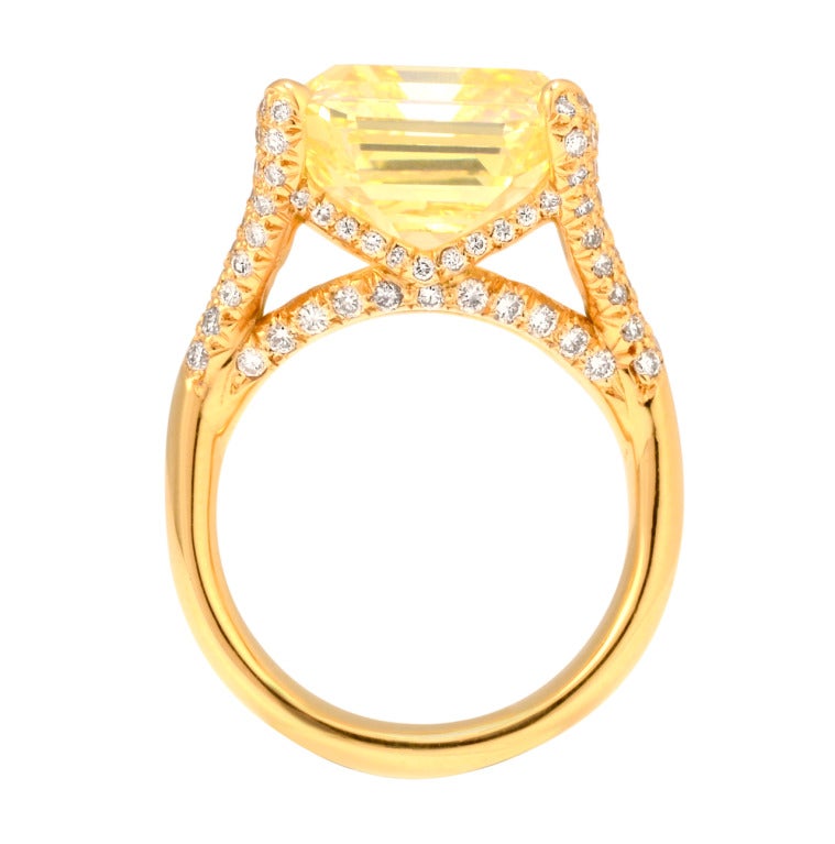 It is easy to find a radiant or cushion-cut diamond that holds Intense Yellow.  A step cut diamond, that has Intense Yellow is much harder to come by.  This 14.36 carat Fancy Intense Yellow is truly one of a kind.  The square emerald has beautiful