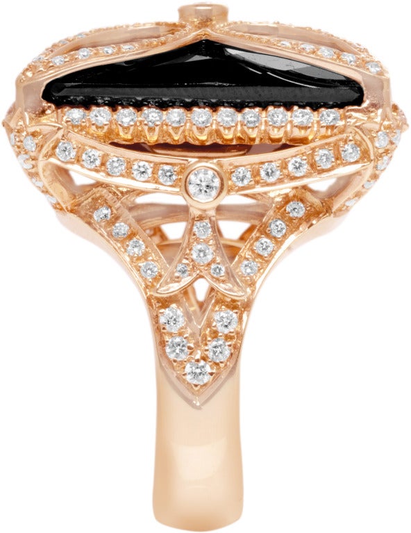 Incredible attention to detail, this rose gold ring has a beautiful onyx center.  1.20 carats of diamonds.  Its a guarantee you will get lots of complements on your new cocktail ring.