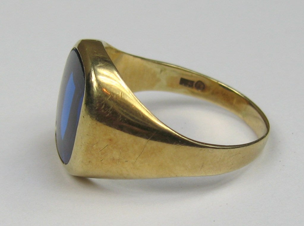 Mad Man style. Large center Beryl stone set in 14k gold 
Ring is a size 12.25
.64mm top to bottom.