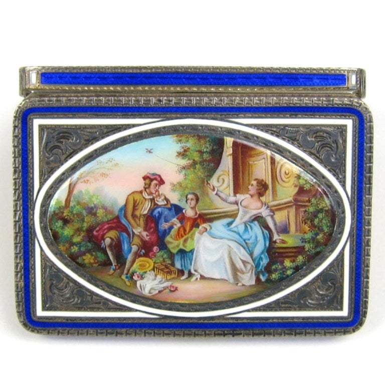 Gorgeous Deep Blue guilloche enameled box with a pierced circular sterling inset and white enameled corners. This hinged box or compact measures 3.06