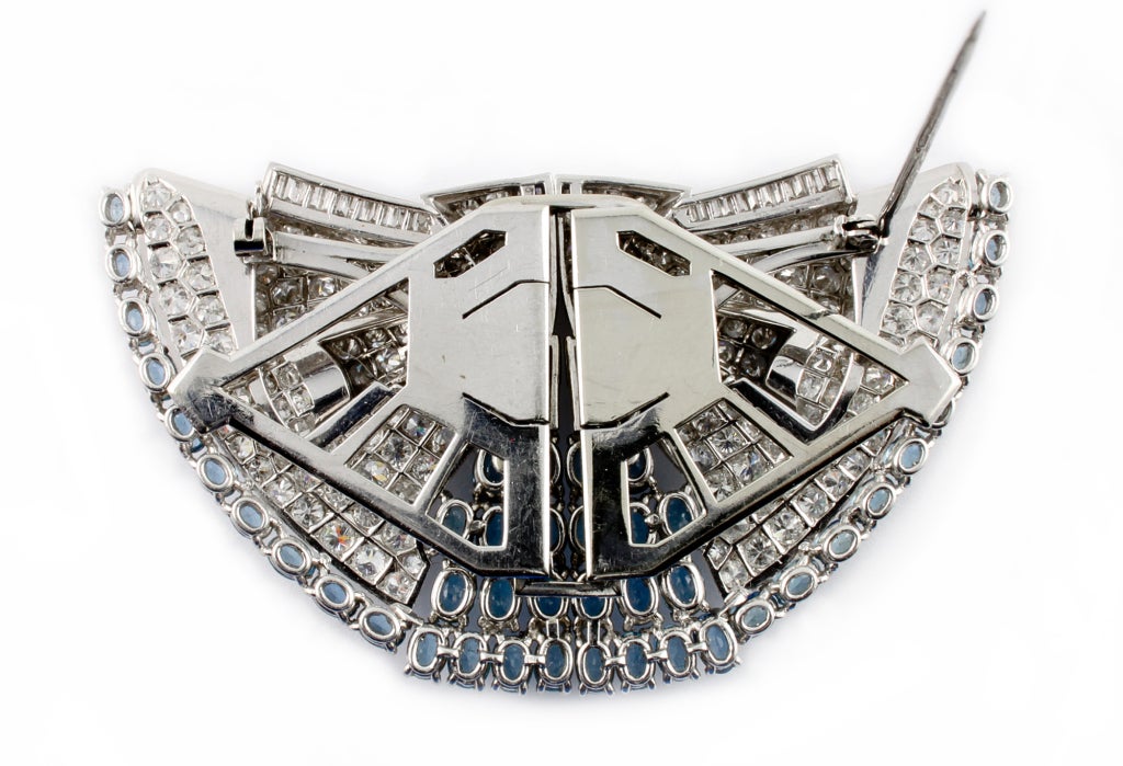 An Art Deco platinum diamond and aquamarine double clip brooch. Probably american, 1930.