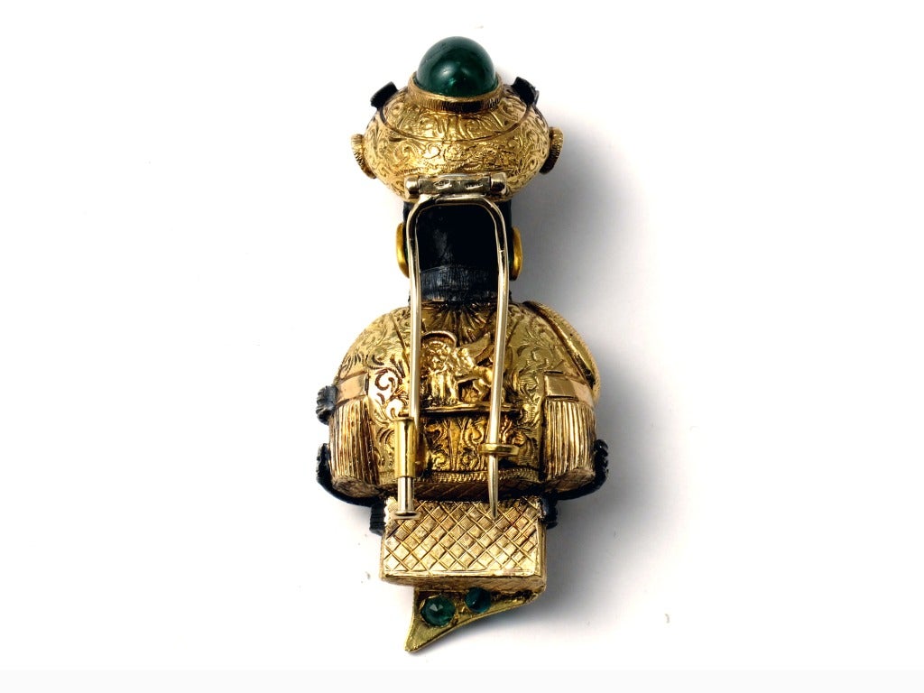 A yellow gold Magi brooch, ebony headed, with diamonds and emeralds. Venice.
