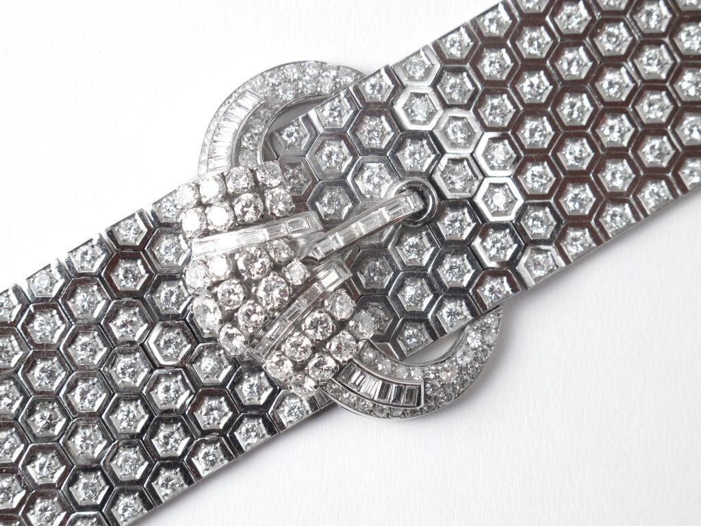 A platinum and diamond bracelet depicting a belt with its buckle. 
Probably France, 1935. numbered, unsigned.