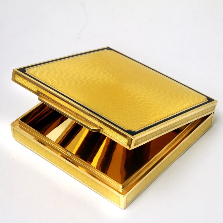 Silver gold plated square box with guilloche decoration under fired yellow enamel, outlined in black enamel.

From the Laura G Collection, a very nice box, an example of an Italian object of art. Simple and very elegant.