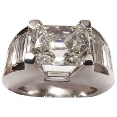 White gold ring set with a 2.59 carat cushion shaped diamond.