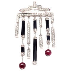 White gold Cartier necklace with rubies, onyx and diamonds.