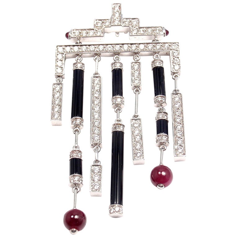 White gold Cartier necklace with rubies, onyx and diamonds. For Sale