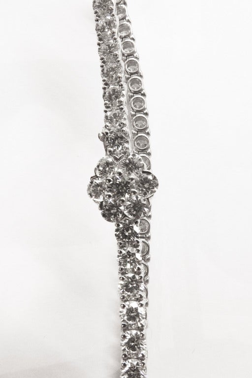 Van Cleef and Arpels White gold and diamonds tennis bracelet.
Set with 7,88 carats of Top quality brilliant-cut diamonds.
A flower is designed on the clasp.
Length : 180 mm.
Weight : 14,9 grams
Current retail price : $76,300