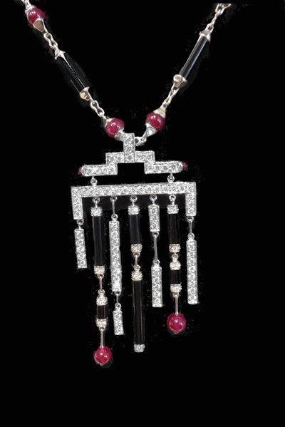 White gold Cartier necklace with rubies, onyx and diamonds. In New Condition For Sale In Paris, IDF