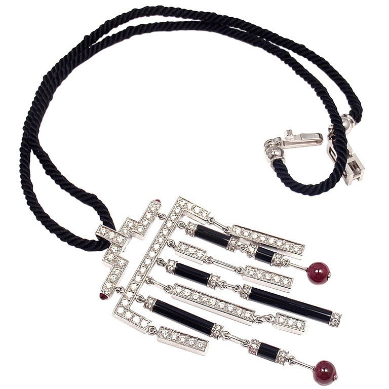 Women's White gold Cartier necklace with rubies, onyx and diamonds. For Sale