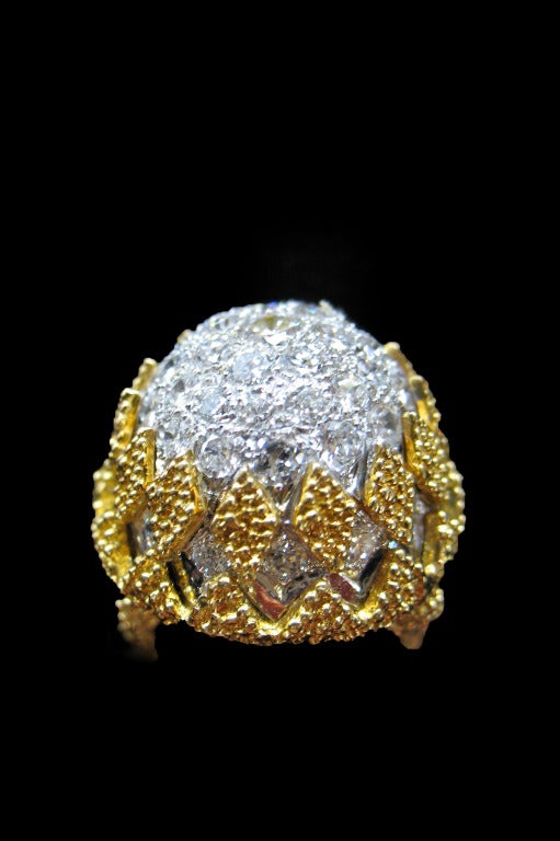 A yellow gold and platinum ring, Arch style, enhanced with yellow gold beads and set with brilliant-cut diamonds in the center.
Height : 17 mm
Diamond weight : Approximately 3 carats. 
Weight : 25 grams
Finger size : 5.75, can be sized.
Circa