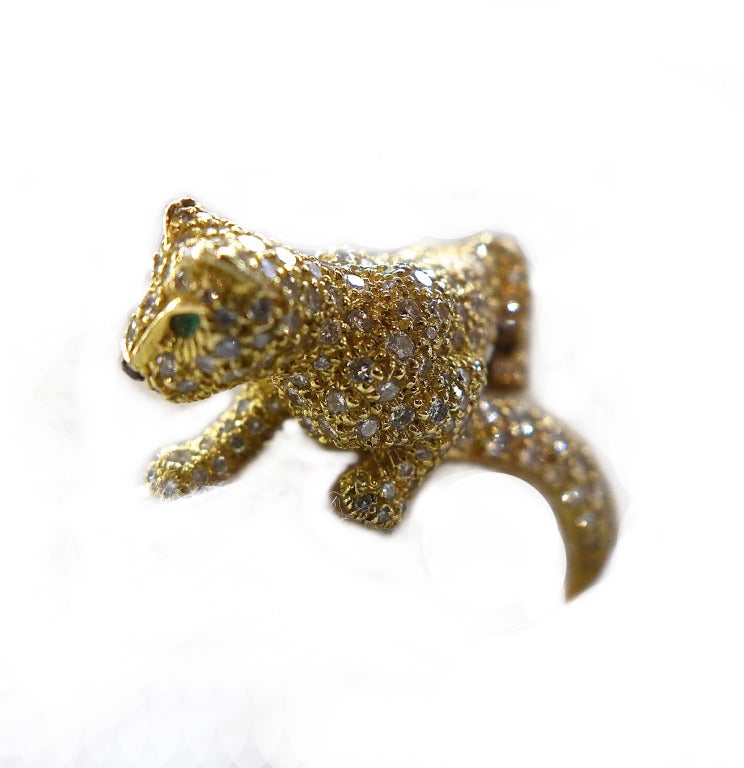 Cartier Panther yellow gold ring set with brilliant cut diamonds.
The eyes are set with emeralds and the nose is made of black enamel.
Size 5,75 can be sized.
Last Retail price : $ 55,200
Circa 2005