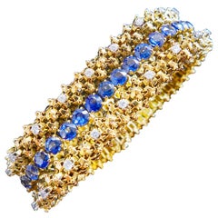 1960's Yellow gold bracelet set with sapphires and diamonds made by André Col.