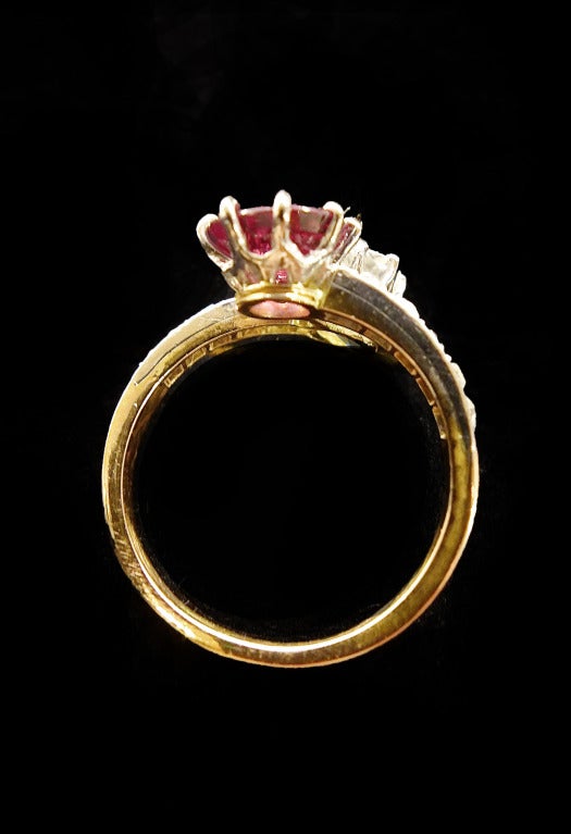 Belle Epoque Diamond Ruby Crossover Ring begining of the 20th century ring set with a cushion cut ruby weighting 1,55 carat and circular old cut diamond of 0,71 carat.
Smaller diamonds enhace the middle stones.
French Gemological certificate