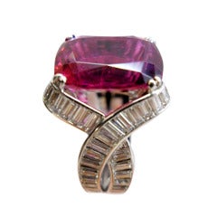 Platinum ring set with a rubellite and baguette-cut diamonds