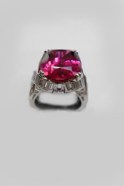 Platinum ring set with a rubellite and baguette-cut diamonds 1