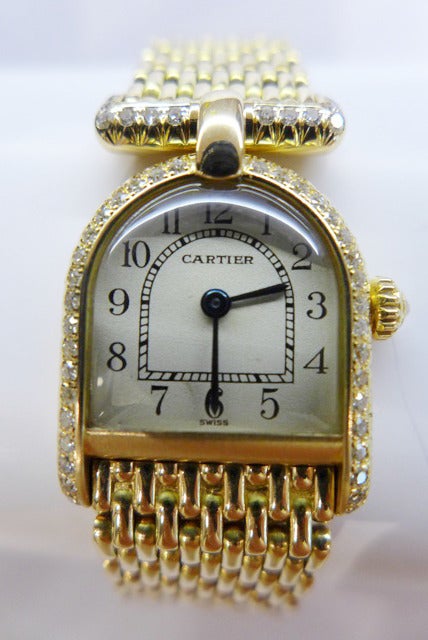 An 18k yellow gold and diamond-set Cartier lady's Calandre wristwatch on a yellow gold 