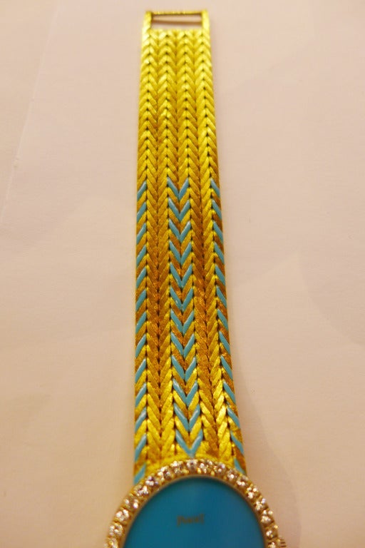 gold and turquoise watch