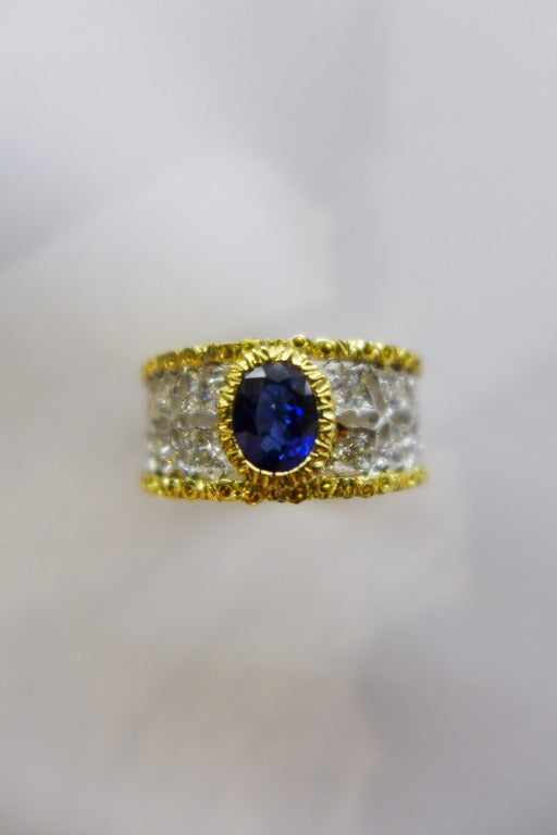 Two colors of 18k gold ring signed by Mario Buccellati set with an oval sapphire in the middle and diamonds on half of the mounting.
Size 5,75.
Retail price : $16,700