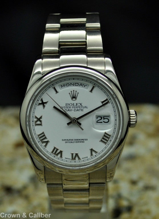 Rolex White Gold Day-Date President Wristwatch Ref 118209 circa 2000

Brand: Rolex
Model Name: Oyster Perpetual Day-Date
Serial: P****** - 2000
Reference: 118209
Dial Window: Sapphire Crystal
Dial Color: White
Hour Markers: Roman