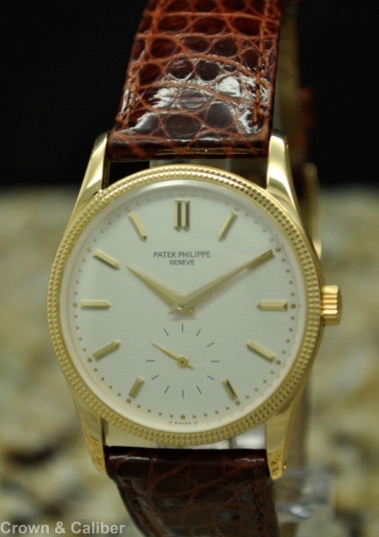 Patek Philippe 18k Yellow Gold Calatrava Wristwatch with Hobnail Bezel, Ref 3796 D, with Box and Papers

Brand: Patek Philippe
Reference Number: 3796 D
Serial Number: 291****
Dial Window: Sapphire Crystal
Dial: White Dial with Gold Hands and