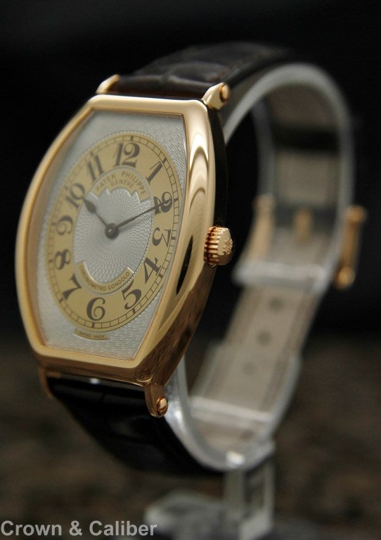 Patek Philippe Rose Gold Gondolo Tonneau Wristwatch Ref 5098R

Brand: Patek Philippe
Model Name: Gondolo
Reference Number: 5098R-001
Serial Number: 4******
Dial Window: Sapphire Crystal
Dial: Hand-guilloched Gold
Display Type: Analog
Case