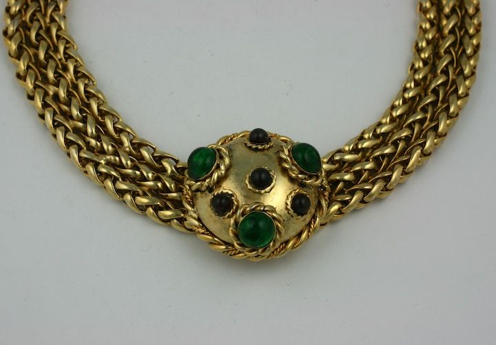 Chanel triple gilt fox chain with central pendant and clasp of ruby and emerald poured glass. Ornate hand twisted wirework surrounds each glass cabochon.   1980s France. <br />
15