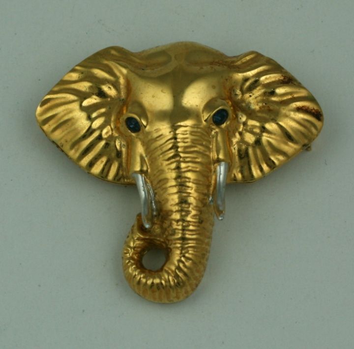Gilt sterling elephant brooch with silver toned tusks. Blue paste eyes. Airoldi,Italy.  2
