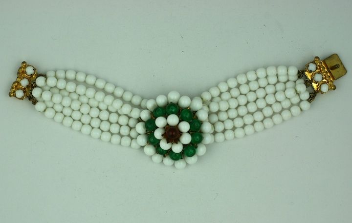 Unusual Italian beaded bracelet with milk glass beads and  ruby and green poured glass accents. Made similar to french jewelry by Rousellet, but Italian in manufacture. 1950s.
Excellent condition. 7