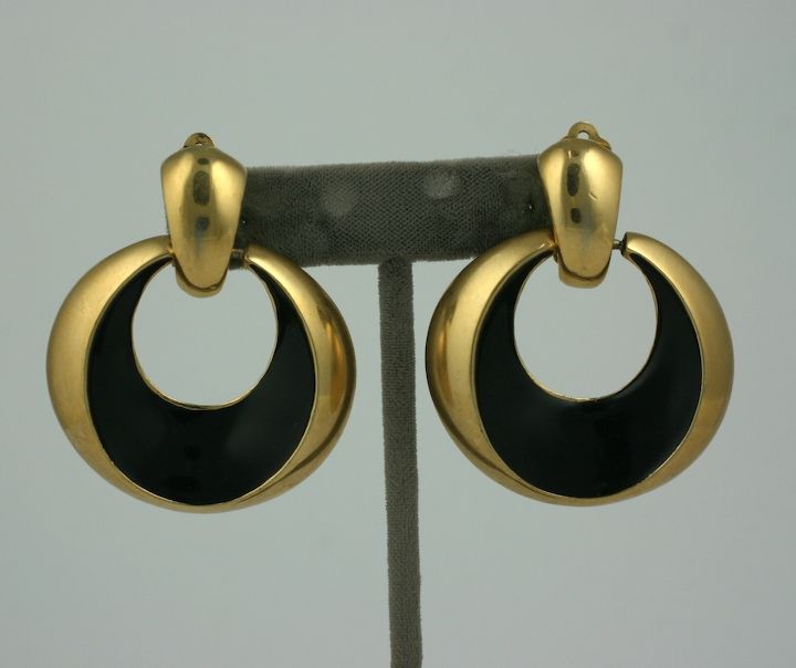 Unusual black enamelled concaved hoop earrings with clip back fittings. Very striking large scale.<br />
2.25 high by 1 7/8 wide, Signed St. Johns<br />
Excellent condition