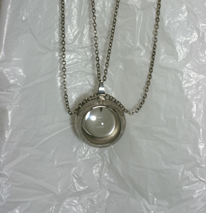 Unusual Mod Lucite and Chrome Pendant from the 1960's. A series of super long chains suspend a chrome ball with and floating lucite sphere within. 
1960's USA. Excellent condition. 