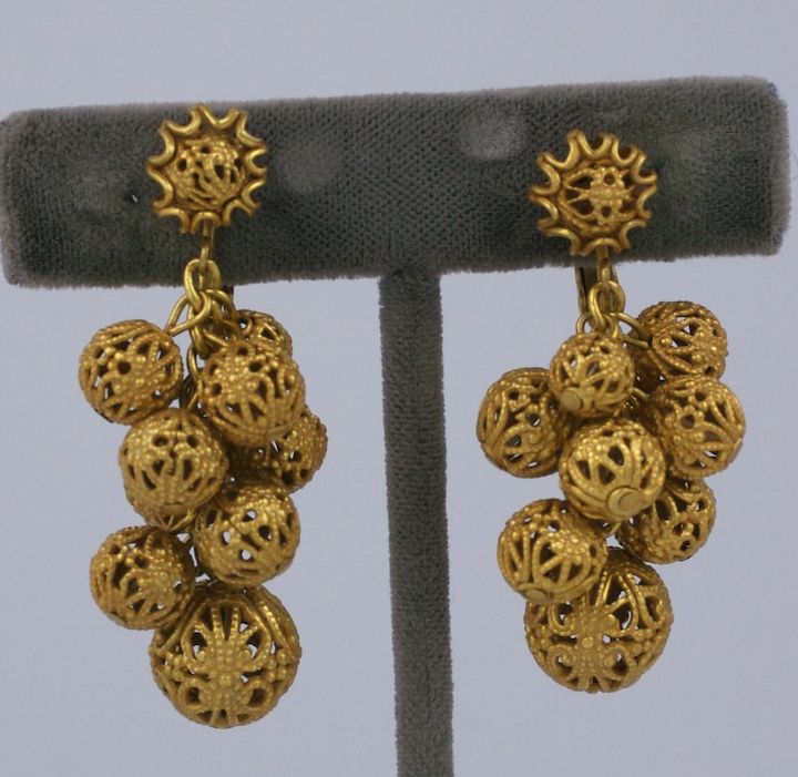 Miriam Haskell signature gilt filigree ball dangle earrings.<br />
Clip back fittings.<br />
2