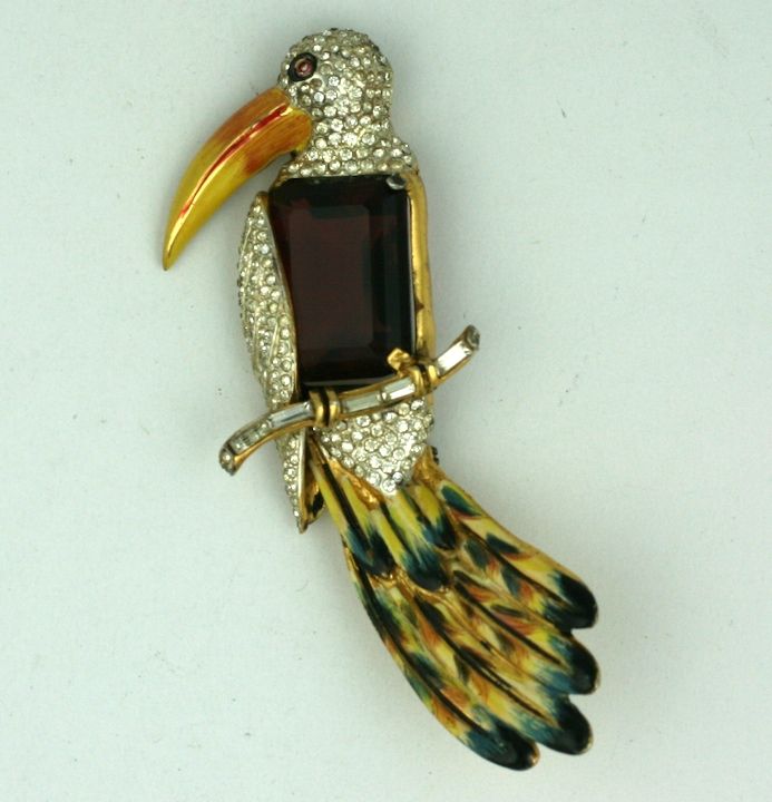 Coro created an iconic, collectible series of figural animal brooches in the late 1930s. All were gilded sterling with handpainted cold enamel. This amazing toucan has an amythest emerald cut stone body with pave accents and enamel. Heavy quality