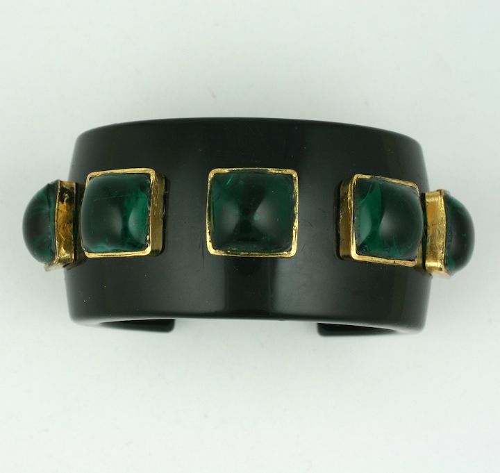 Striking Chanel black bakelite bangle with emerald poured glass 