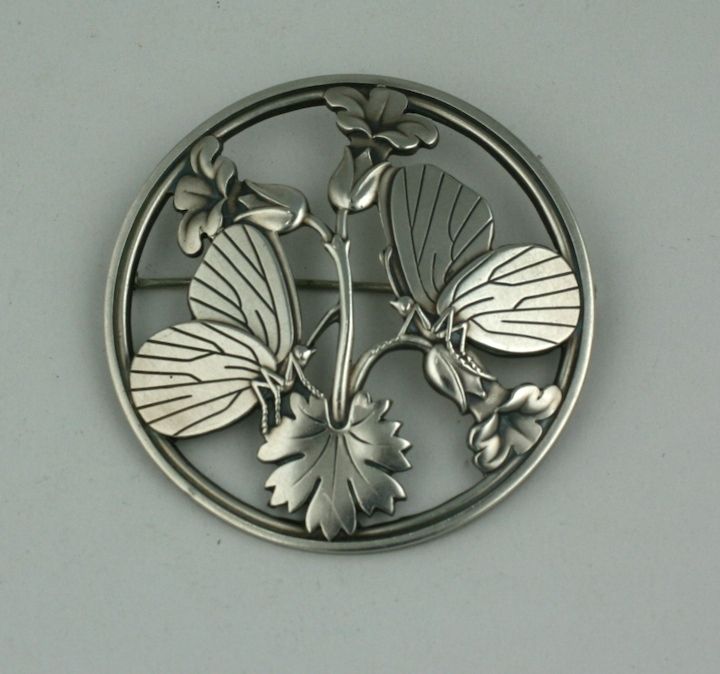 Large Jensen sterling brooch done in the deco style with 2 butterflies resting on a blooming flower. Heavy gauge sterling and quality. <br />
Signed: Georg Jensen, Denmark 925<br />
2.25