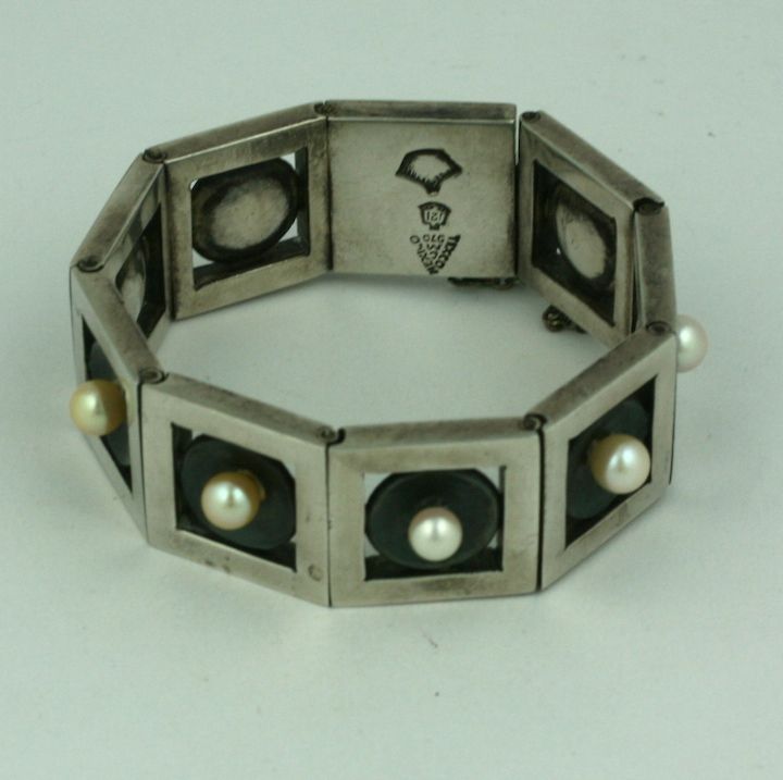 Extraordinary sterling silver link bracelet by modernist master Antonio Pineda, Mexico. Blackened silver discs set with cultured pearls float within heavy square framed links. Wonderful for men or women. 1940s Taxco, Mexico. Heavy quality sterling
