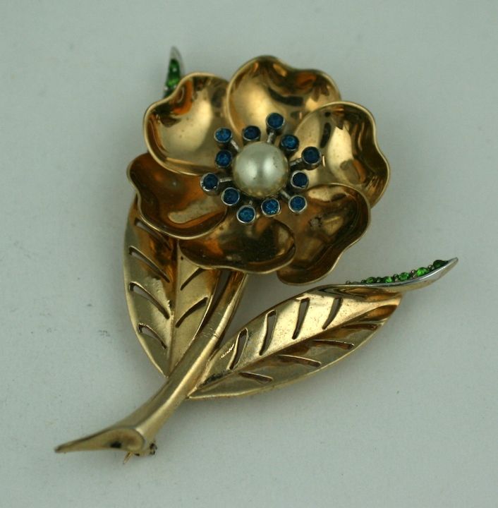 Charming Marcel Boucher mechanical flower brooch. Petal can be moved so flower is closed or open. Set with colored pastes and faux pearl. 1950's USA. 2.75