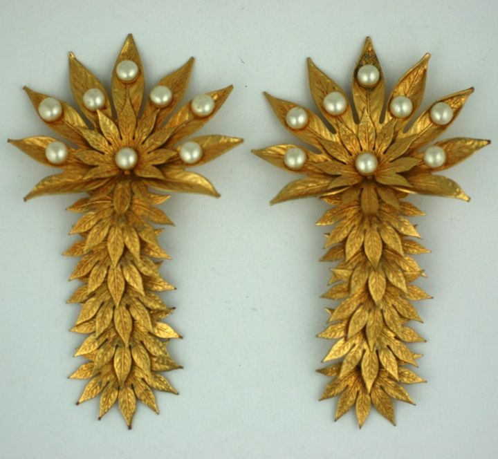 Rare Dominique Aurentis pearl and gilt metal overlapping palm frond massive earclips.Each segment of leaves is articulated and moves when worn.<br />
Excellent condition.<br />
5.5