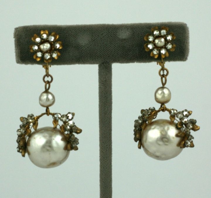 Miriam Haskell pearl and rose monte drop earrings. Large faux pearls embroidered w paste leaves. Clip back fittings.  Usa 1940<br />
Excellent condition.