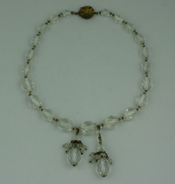 Facetted rock crystal bead necklace with gilt spacers and pendants from the 1920s. Length: 16