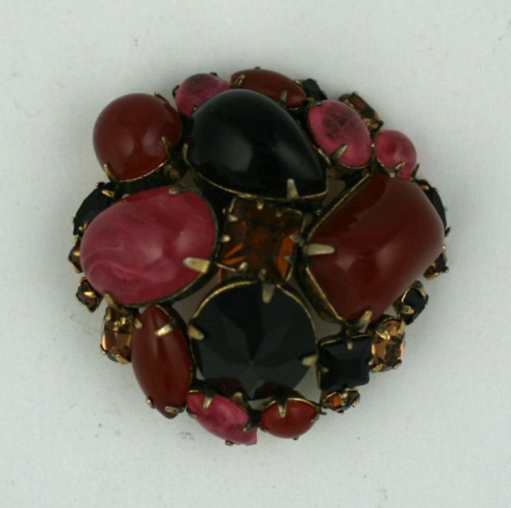 Bombe form clip by Schreiner NY of faux carnelians,jet and citrines. Fancy cut stones in unusual configurations as exemplified by Schreiner. Excellent condition. USA 1.75